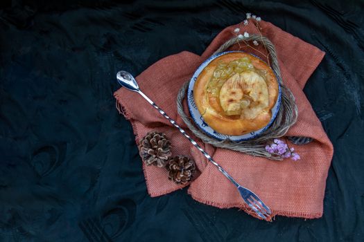 Traditional French sweet dessert : Apple Brioche on beautiful background. One piece,  Delicious seasonal breakfast. Top view, Selective focus.