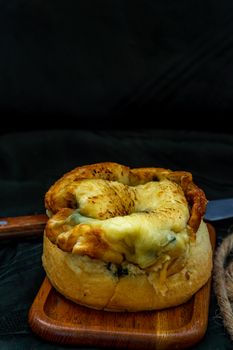 Traditional French sweet dessert : Spinach Brioche on the wooden tray. One piece, Delicious seasonal breakfast. Oblique view from the top, Selective focus.