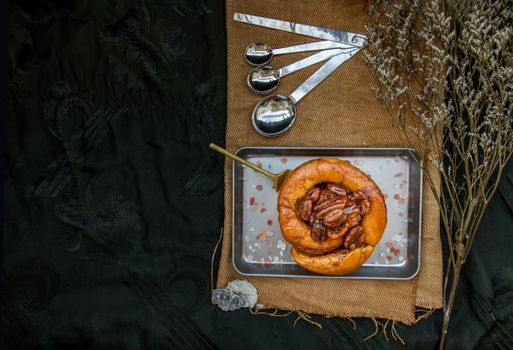 Traditional French sweet dessert : Pecan peanut Brioche on the silver tray. Delicious seasonal breakfast, Top view. Selective focus.