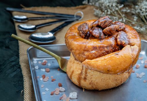 Traditional French sweet dessert : Pecan peanut Brioche on the silver tray. Delicious seasonal breakfast, Oblique view from the top. Selective focus.