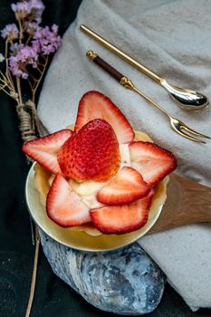 Traditional French sweet dessert : Strawberry tart on beautiful background. One piece, Delicious seasonal breakfast. Top view, Selective focus.