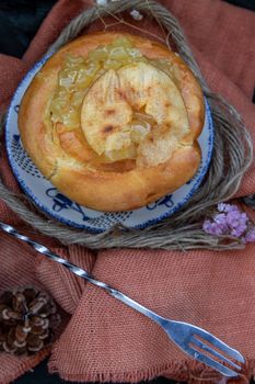 Traditional French sweet dessert : Apple Brioche on beautiful background. One piece,  Delicious seasonal breakfast. Top view, Selective focus.