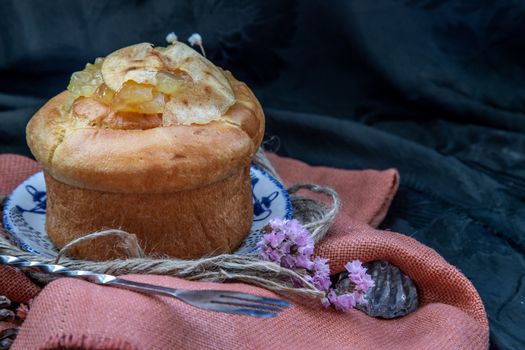 Traditional French sweet dessert : Apple Brioche on beautiful background. One piece. Delicious seasonal breakfast. Oblique view from the top, Selective focus.