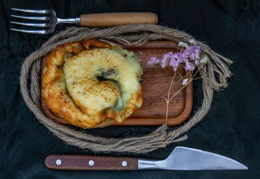 Traditional French sweet dessert : Spinach Brioche on the wooden tray. One piece, Delicious seasonal breakfast. Top view, Selective focus.