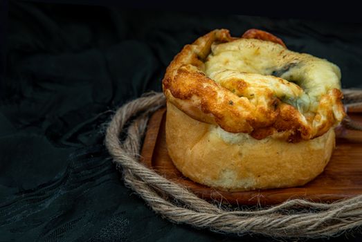 Traditional French sweet dessert : Spinach Brioche on the wooden tray. One piece, Delicious seasonal breakfast. Oblique view from the top, Selective focus.