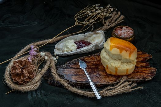 Traditional french sweet dessert : Scones on the wooden tray served with Homemade raspberry jam and Mascarpone cheese on Shell. Delicious seasonal breakfast. Selective focus.