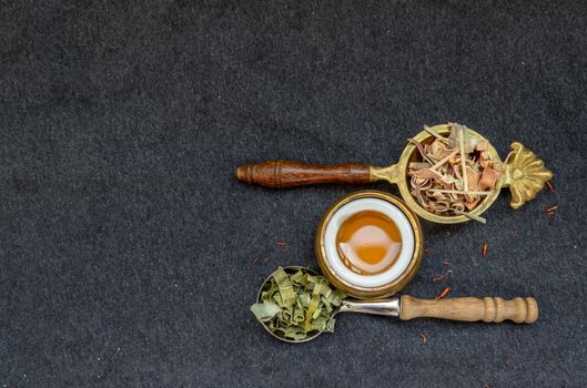 Wonderful Thai herbal tea with Dried lemongrass herb and pandanus on spoons with honey. Organic herbal, Selective focus, Copy space.