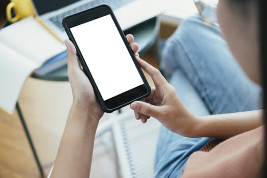 Close up of woman hand holding smart phone. Blank screen mockup for graphics display montage.