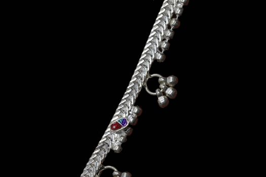 Beautiful catalogue design book of silver anklets on black background