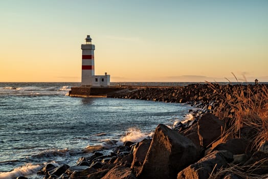The Gardur lighthouse at sunset in Iceland