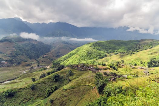 Green rice terraces at highlands Sa Pa village in the mountains of Sapa of North Vietnam