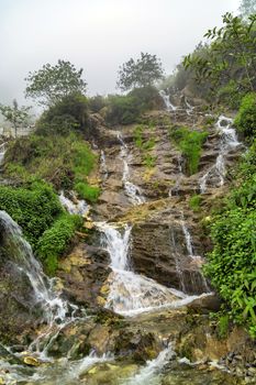 Landscape Waterfall cascade in jungle tropical rainforest