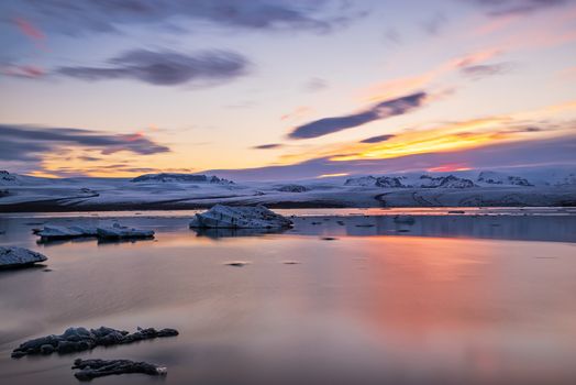 Colorful sunset in Jokulsarlon glacier lagoon in Vatnajokull National Park, Iceland