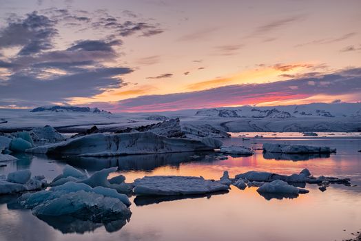 Colorful sunset in Jokulsarlon glacier lagoon in Vatnajokull National Park, Iceland