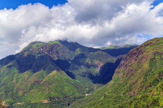 Vietnamese mountain in sunlight under cloudy sky. Sapa, Vietnam.