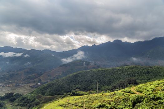 Smoky Mountains panoramic view to the green rice terraces highlands of Sapa District, Lao Cai Province, Vietnam. Sa Pa Asia.