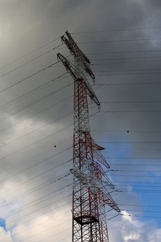 A high voltage paste against a cloudy sky