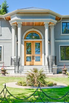 A perfect neighbourhood. Entrance of luxury family house with doorsteps in front