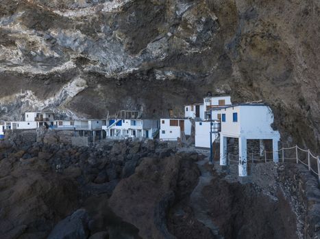 Cueva de Candelaria, Pirate cave Poris de Candelaria, small hidden fisherman village with white and blue houses, tourist attraction near Tijarafe, La Palma, Canary islands, Spain.