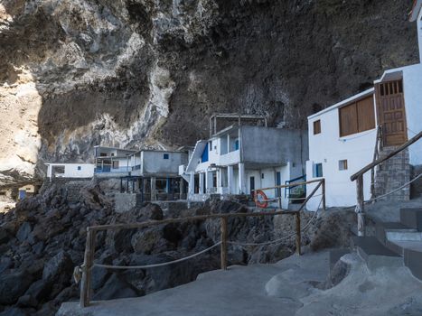 Cueva de Candelaria, Pirate cave Poris de Candelaria, small hidden fisherman village with white and blue houses, tourist attraction near Tijarafe, La Palma, Canary islands, Spain.