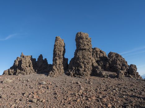 Lava rock formation at top Roque de los Muchachos mountain peak in Caldera Taburiente La Palma at Canary Islands, blue sk backgorund.