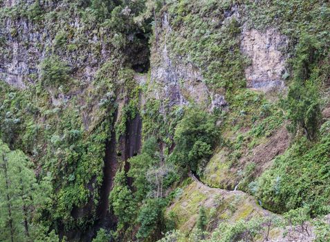 Aerial view at hiking trail Casa del Monte to Los Tilos along Levada and water tunnel. Beautiful nature reserve on La Palma, Canary islands, Spain.