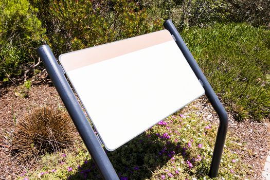 Blank white sign notice board in Green Point Park, Cape Town.