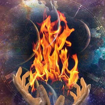 Hands with fire on abstract space background