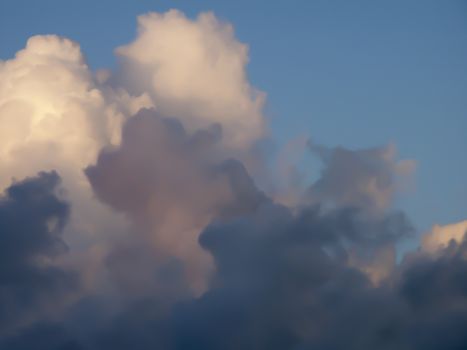 Cumulus clouds in rays of sun