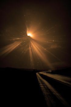 Single car travels on dark road. Bright star in the night sky