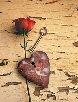 Surrealism. Red rose and rusted heart with keyhole. Golden key.