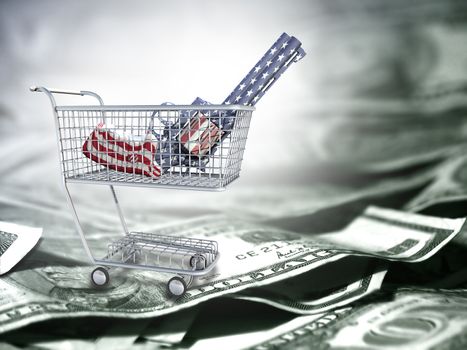 Gun in national colors in a cart. US dollars.