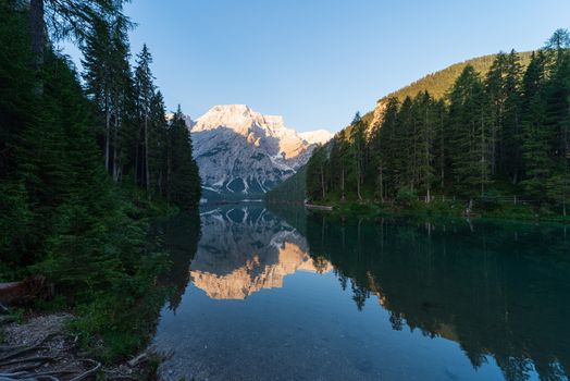 Mountain landscape with reflections on the Braies lake in Val Pusteria, South Tyrol Dolomites