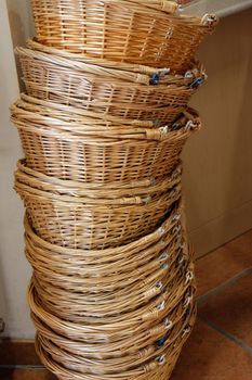 Stack of wicker baskets for shopping in a organic grocery store