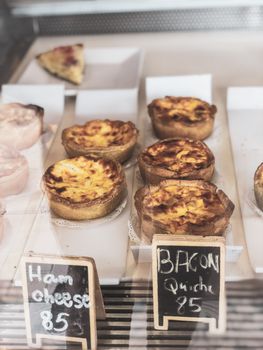 Delicious breakfast egg muffins with sausage, bacon, baked beans and hash brown.