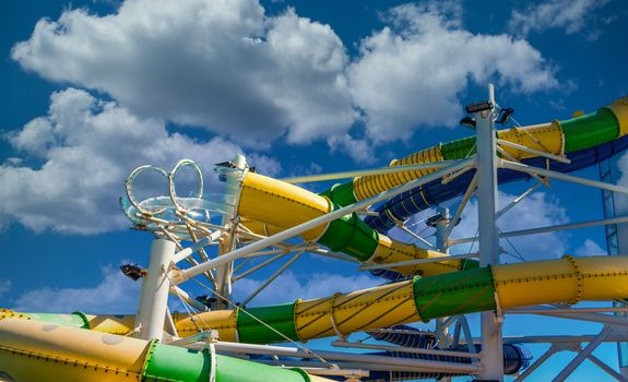 Curving and colorful waterslides on a luxury cruise ship