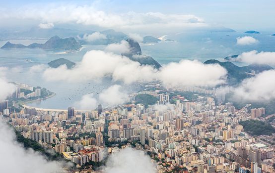 Rio city center downtown panorama with coastline and Sugar Loaf mountain covered in clouds, Rio de Janeiro, Brazil