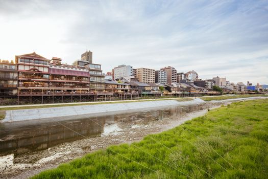 KYOTO, JAPAN - May 15 2019: Ancient houses and restaurants along Kamo river in Gion, Kyoto, Japan