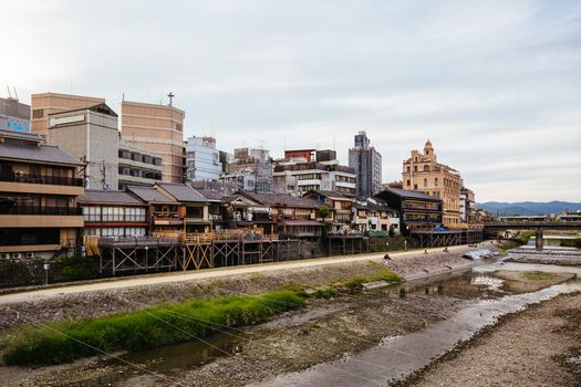 KYOTO, JAPAN - May 15 2019: Ancient houses and restaurants along Kamo river in Gion, Kyoto, Japan