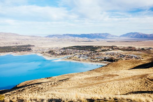 The view over the town of Tekapo from Mt John Walkway and observatory area near Lake Tekapo on a clear spring evening in New Zealand