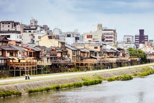 KYOTO, JAPAN - May 14 2019: Ancient houses and restaurants along Kamo river in Gion, Kyoto, Japan