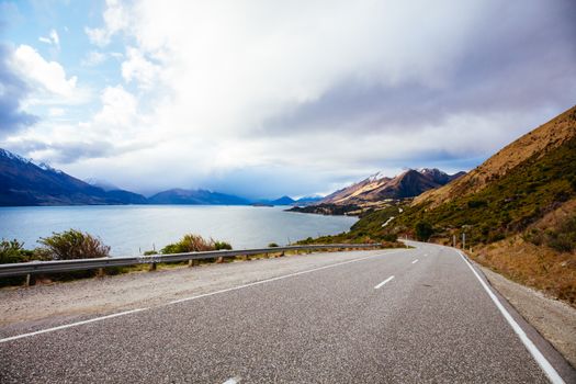 Lake Wakatipu and surrounding mountains, including Tooth Peaks from near Bennetts Bluff Lookout, on a sunny spring day approaching sunset near Glenorchy in New Zealand