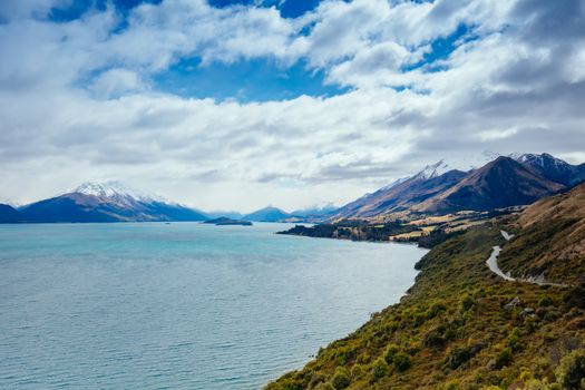 Lake Wakatipu and surrounding mountains, including Tooth Peaks from near Bennetts Bluff Lookout, on a sunny spring day approaching sunset near Glenorchy in New Zealand