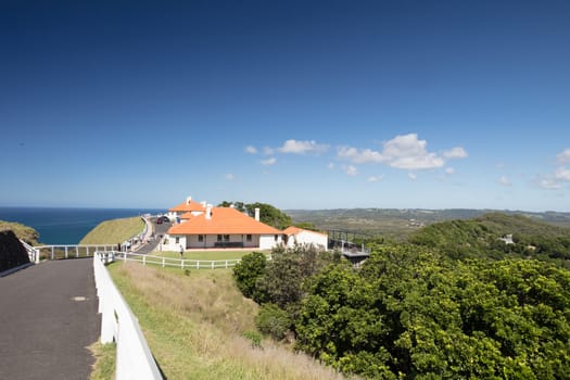 The iconic and famous Byron Bay lighthouse on a hot autumn day in Byron Bay, New South Wales, Australia.