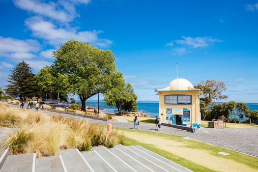 Cowes, Australia - December 8 2019: Cowes Foreshore and its iconic jetty and beach on a warm summer's day in Philip Island, Australia