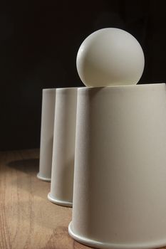 Disposable paper cups and ping pong ball