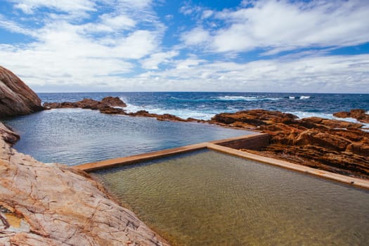 The iconic and famous Blue Pool on a cool autumn afternoon in Bermagui, New South Wales, Australia