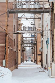 Downtown Fargo on Broadway back alleyway during a snow storm