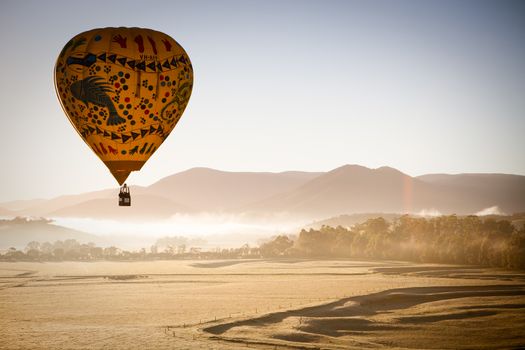 A sunrise hot air balloon flight over the Yarra Valley in Victoria, Australia