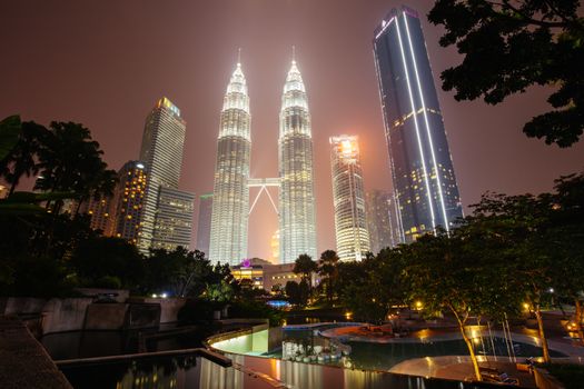 Kuala Lumpur, Malaysia - September 12 2019: The Kuala Lumpur skyline at KLCC featuring the Petronas Twin Towers and water show in Malaysia